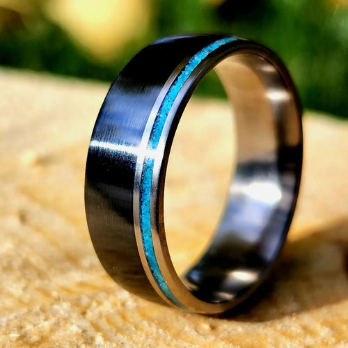 Black titanium and titanium with thin turquoise accent