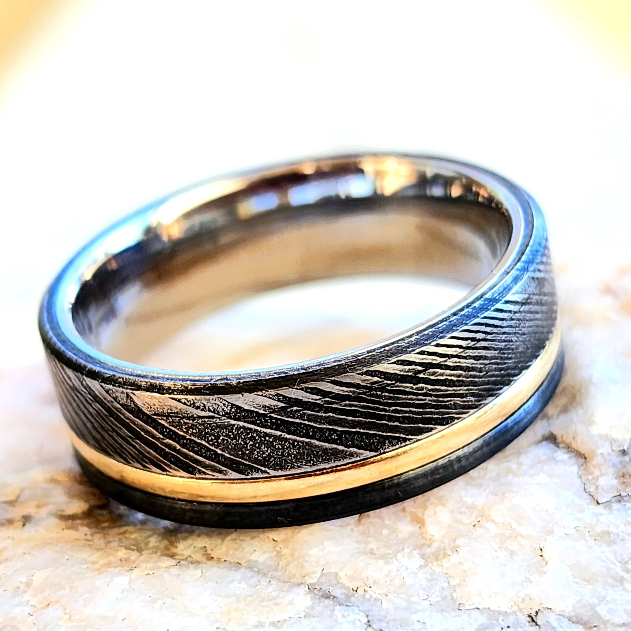 Stainless Steel Damascus and black titanium with 14k gold accent
