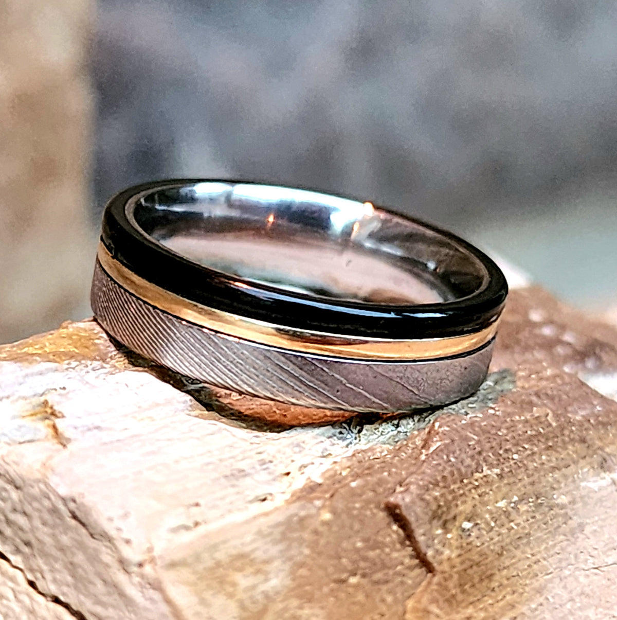 Stainless Steel Damascus and black titanium with 14k gold accent