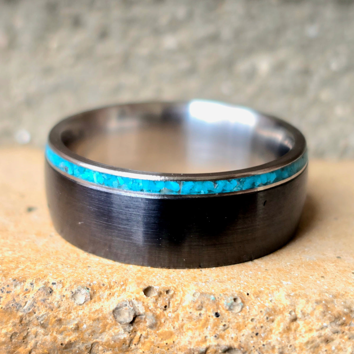 Black titanium and titanium with thin turquoise accent
