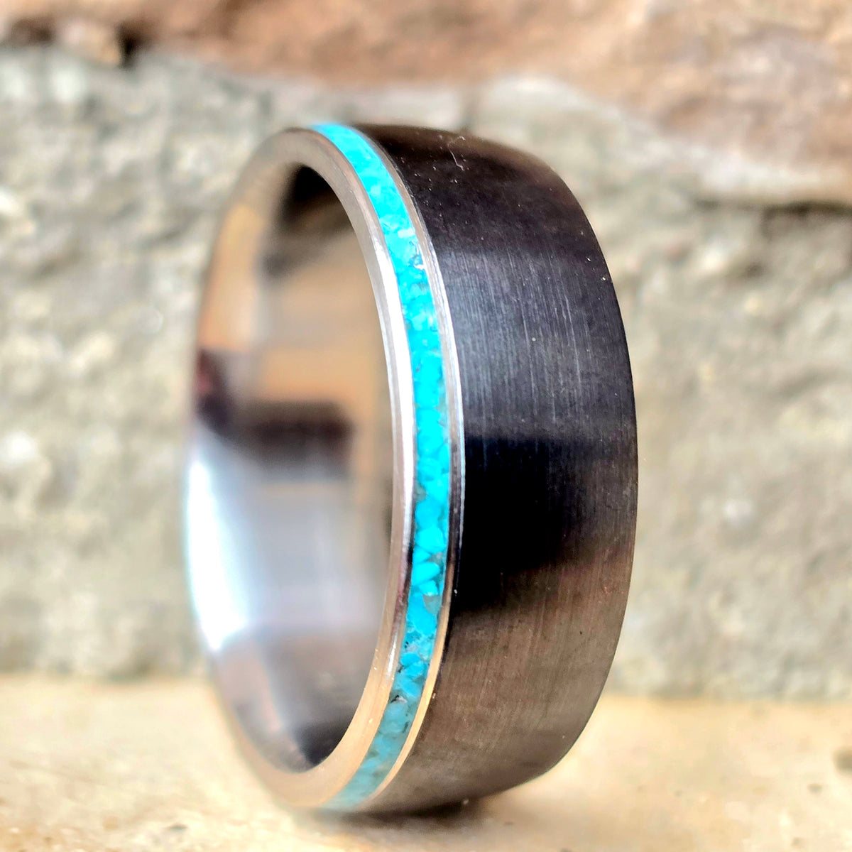 Black titanium and titanium with thin turquoise accent